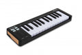 Black MIDI keyboard controller with 25 keys, buttons, sliders, and wooden side panels.