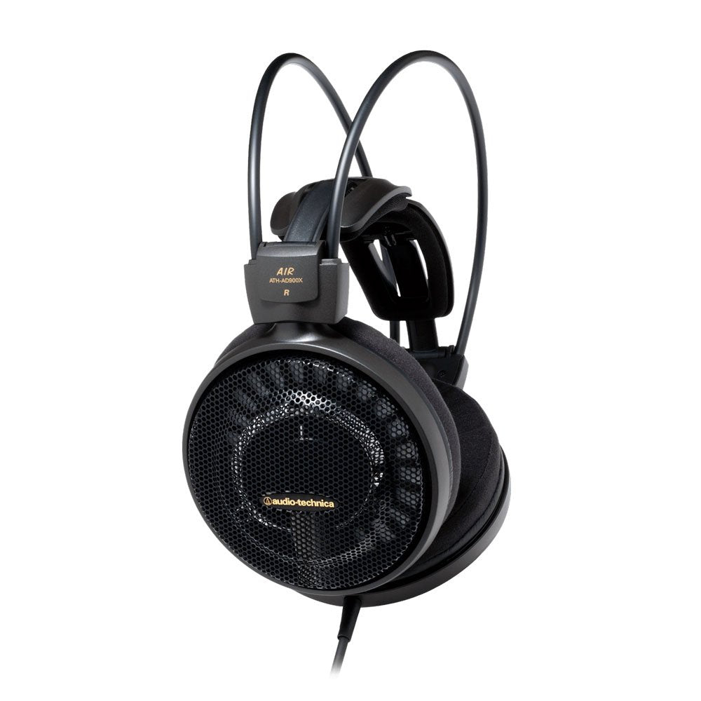 Black over-ear wired headphones with visible branding and mesh ear cup covers.