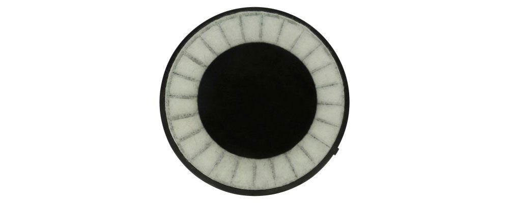 Round headphone ear pad or speaker grille with a black center and white segmented ring.