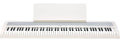 White digital piano keyboard with music stand and KORG branding on the front panel.