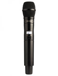 Black handheld wireless microphone with mesh grille and LCD screen displaying frequency and battery level.