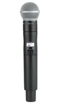 Black handheld wireless microphone with metal mesh grille and digital display showing frequency and battery status.