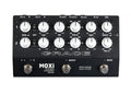 Black instrument preamplifier unit with multiple rotary knobs, toggle switches, and footswitches labeled MOXi by Grace Design.