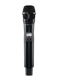 Black handheld wireless microphone with mesh grille and digital display on the body
