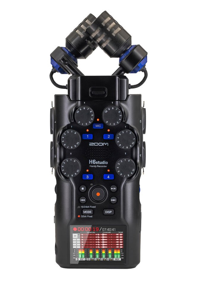 Black handheld audio recorder with rotary knobs, push buttons, microphone capsules, and a color display screen.
