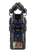 Black handheld audio recorder with rotary knobs, push buttons, microphone capsules, and a color display screen.