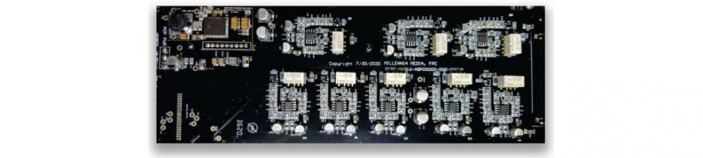 Black circuit board with multiple mounted integrated circuits and white connectors arranged in rows