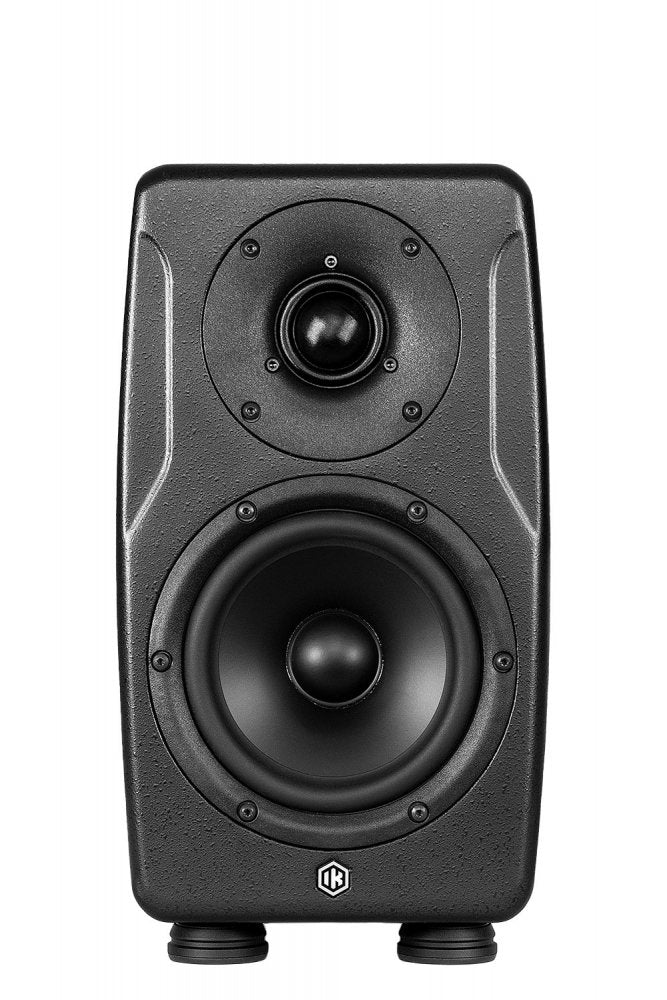 Front view of a black studio monitor speaker with two drivers and IK logo at the bottom.