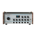 Silver and black audio effects unit with wood sides, rotary knobs, toggle switches, and 1/4 inch jacks on the front panel.