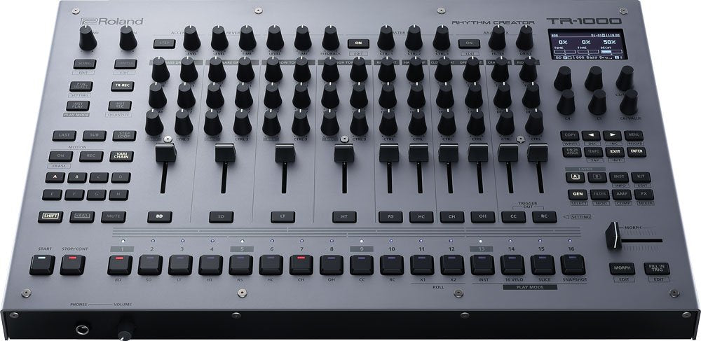 Top view of a Roland TR-1000 rhythm creator drum machine with multiple knobs, faders, buttons, and a small display screen.