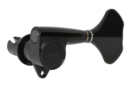 Black Gotoh bass guitar tuner with gold accent ring and visible logo on knob.
