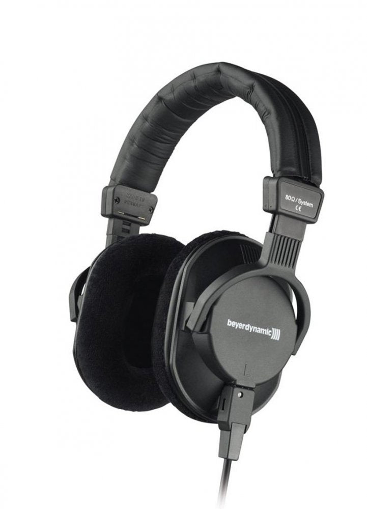 Black over-ear wired headphones with padded headband and fabric-covered ear cushions.