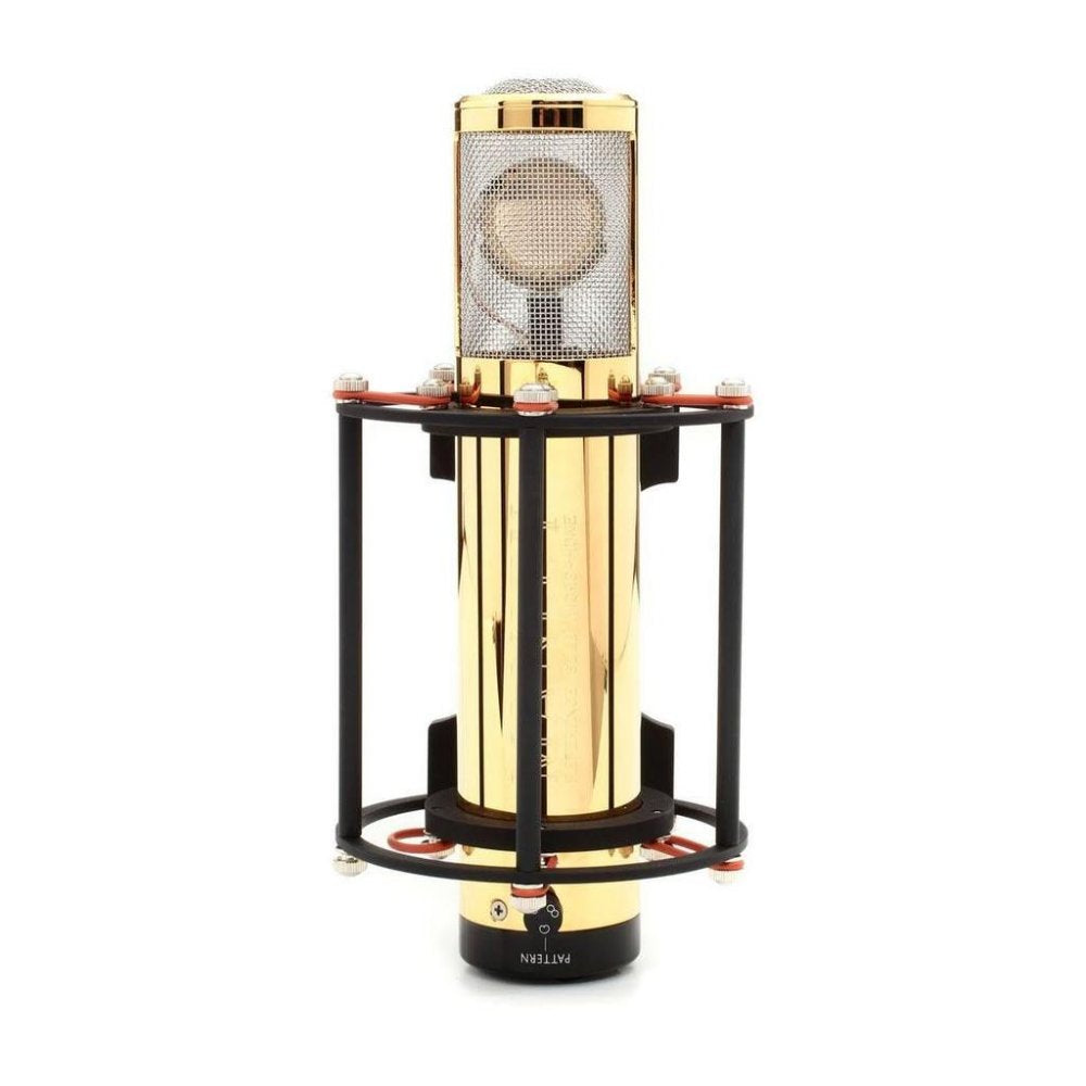 Gold-colored large-diaphragm studio microphone in a black shock mount with a mesh grille.