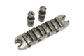 Antique chrome metal guitar or bass bridge with two matching adjustment screws on white background.