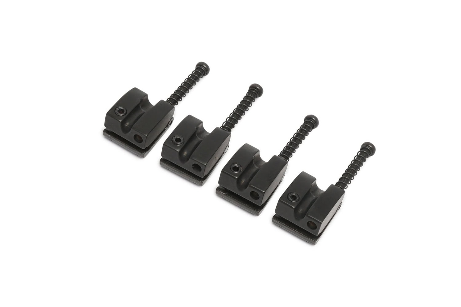 Four black metal bass saddles with adjustment screws displayed on white background.