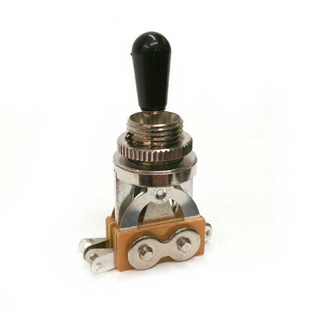 Metal toggle switch with black plastic tip and solder lugs on beige base