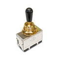 Close-up of a metallic toggle switch with a gold mounting ring and black tip, showing spade terminals.