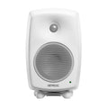 Front view of a white Genelec studio monitor speaker with metal speaker grilles and green indicator light.