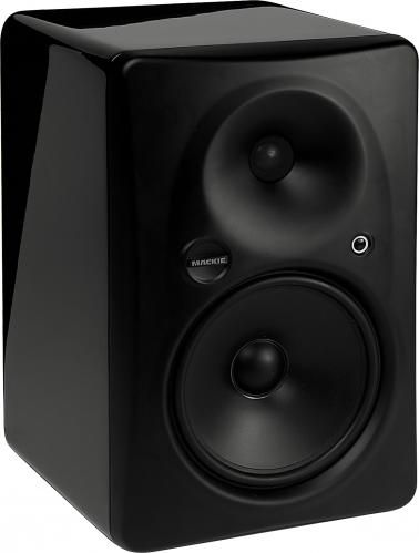 Black studio monitor speaker with two drivers and a small control knob on the front panel.