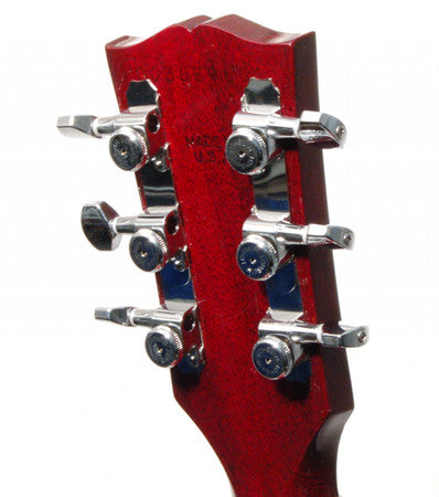 Rear view of a red guitar headstock with six chrome tuning pegs arranged 3+3.