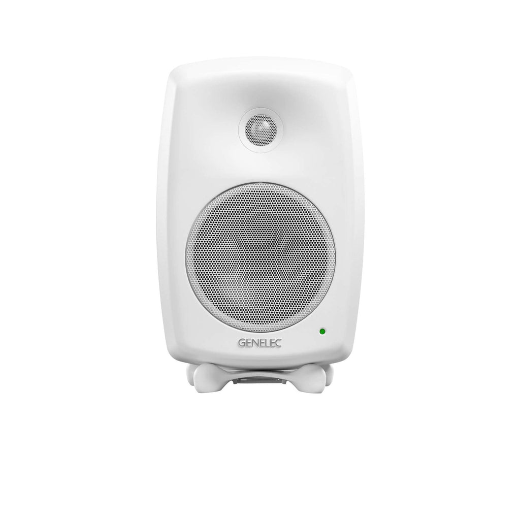 Front view of a white studio monitor speaker with two speaker grills and a green indicator light.