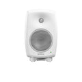 Front view of a white studio monitor speaker with two speaker grills and a green indicator light.
