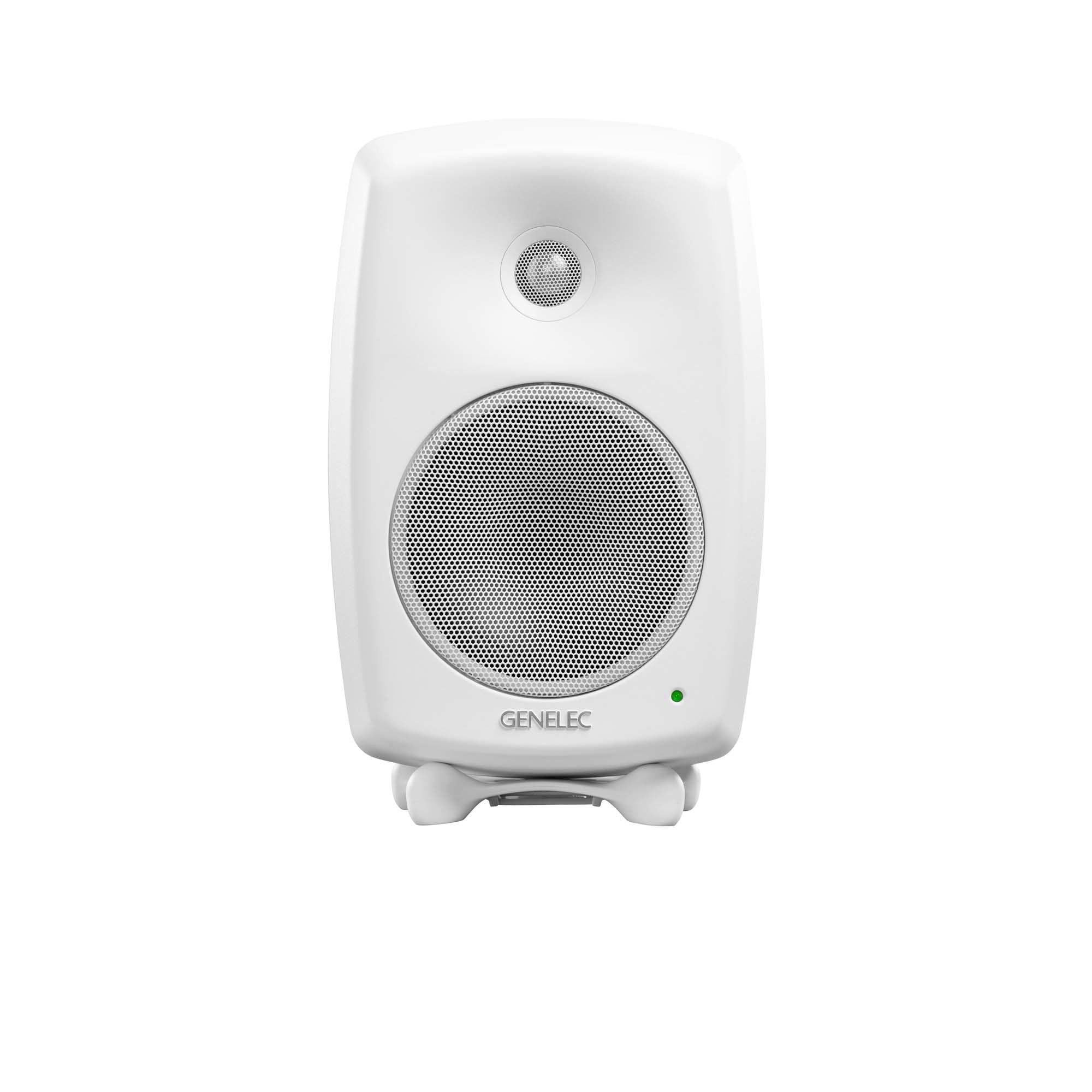 Front view of a white studio monitor speaker with two speaker grills and a green indicator light.