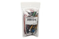Plastic bag containing a guitar pickup conversion kit with potentiometers, wires, and a terminal block.