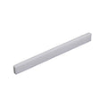 White flat rectangular strip likely used as a guitar saddle or similar part.