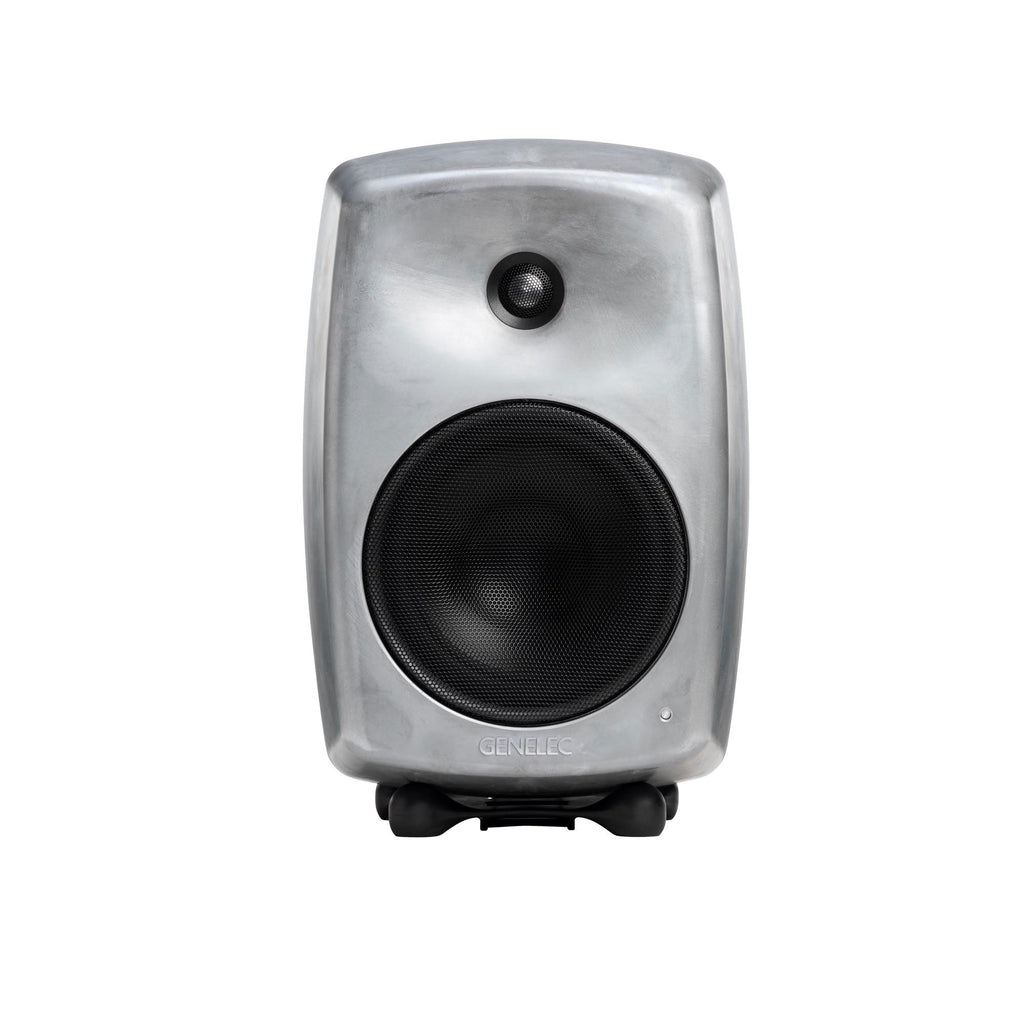 Front view of a gray studio monitor speaker with black mesh covers and Genelec branding.