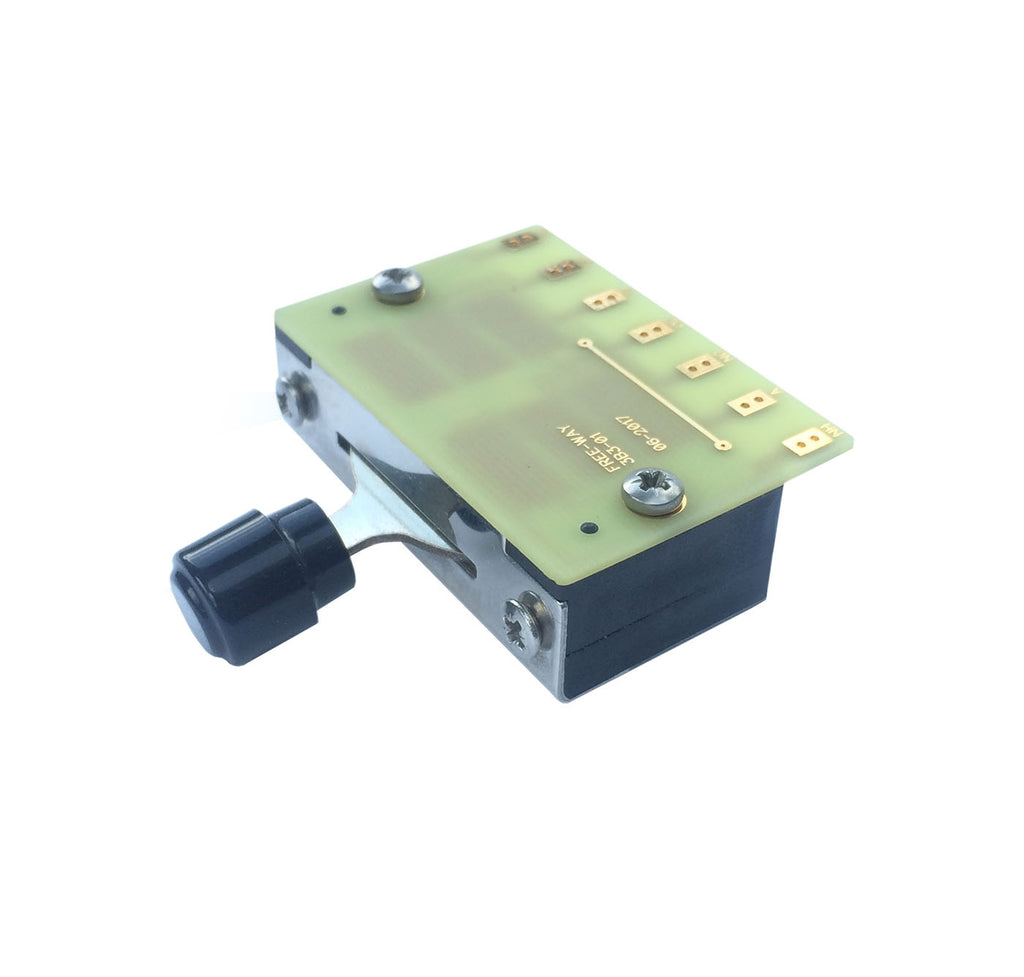 Black plastic and metal 3-way switch with circuit board and solder pads, marked Free-Way 3B3-01