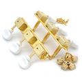 Two sets of gold 3-on-a-plate guitar tuners with white buttons, screws, and washers on a white background.