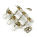 Three-on-a-plate guitar tuner set with white pearloid buttons, brass gears, and mounting hardware.