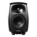 Front view of a black Genelec studio monitor speaker with a metal mesh woofer and tweeter.