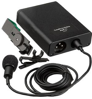Black wired lavalier microphone with foam windscreen, clip, and rectangular body unit with connector.