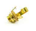 Gold-colored panel mount audio jack with mounting nut and insulating washers on white background.