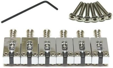 Set of six metal guitar saddles with screws and an Allen wrench on a white background