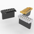 Three metal guitar bridges in black, gold, and silver finishes shown on a white background.