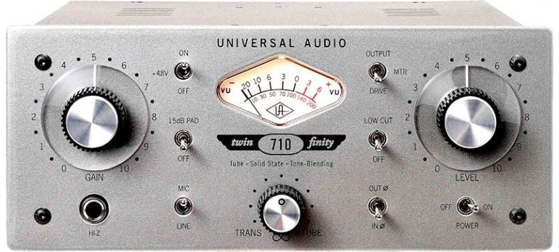 Silver audio device with control knobs, toggle switches, a VU meter, and a 1/4 inch jack on front panel.