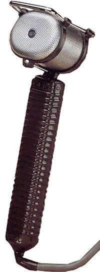 Silver handheld microphone with a perforated grille and a black ribbed handle connected to a cable.