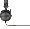Black over-ear wired headphones with inline volume control and leather padded headband.