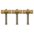 Three gold-colored brass saddles each with a spring and screws shown on a white background.