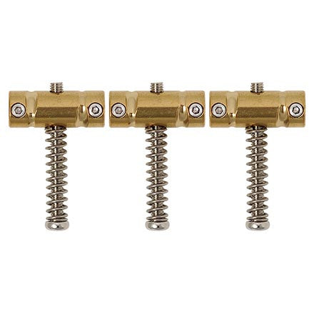 Three gold-colored brass saddles each with a spring and screws shown on a white background.