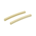 Two cream-colored curved plastic string nut blanks on a white background.