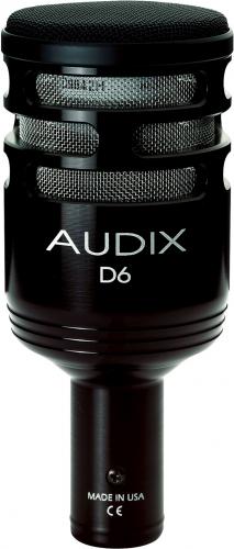 Black cylindrical microphone with metal mesh grille and white AUDIX D6 branding.