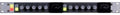 Front panel of a black dual stereo audio compressor with knobs, switches, and meters in a silver rack mount frame.