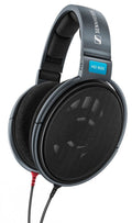 Gray over-ear headphones with black fabric ear pads, a metal mesh ear cup, and wired cable connectors.
