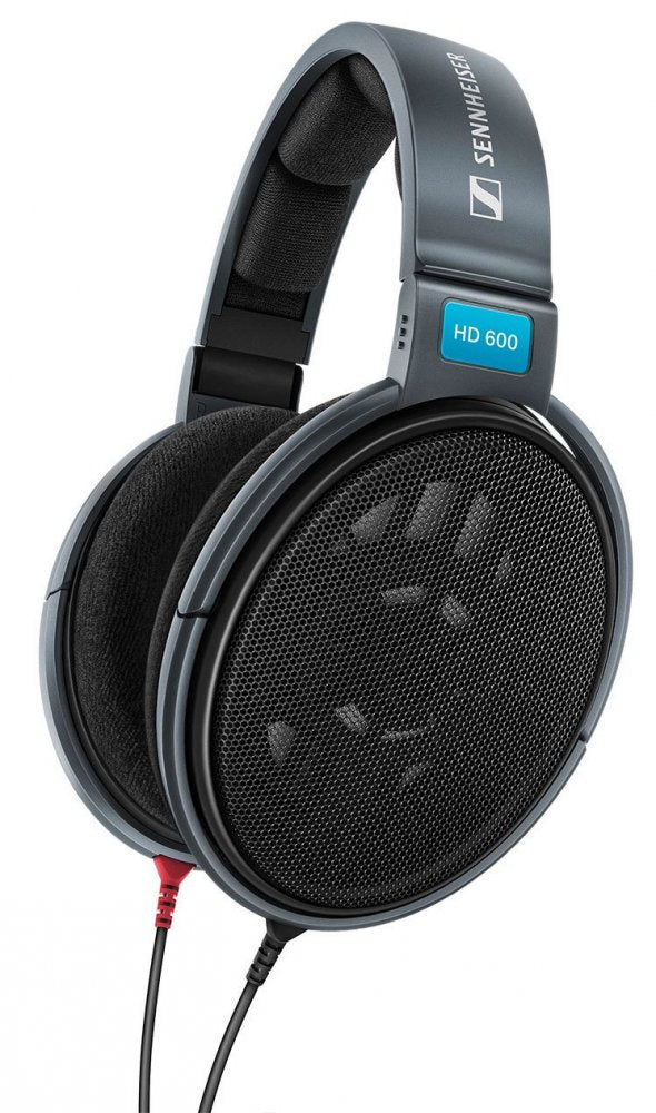 Gray over-ear headphones with black fabric ear pads, a metal mesh ear cup, and wired cable connectors.