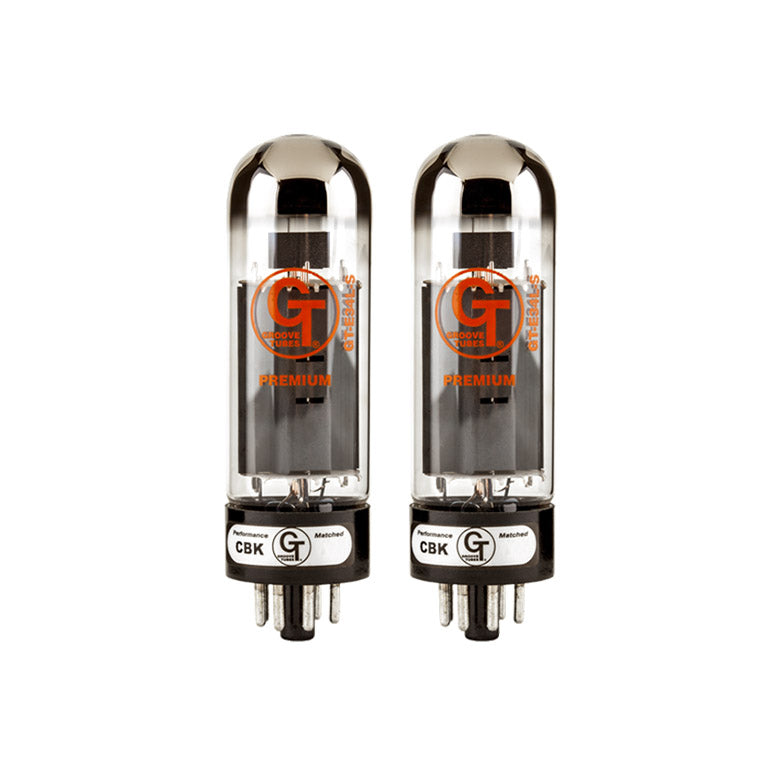 Two clear glass vacuum tubes with black bases and orange GT Groove Tubes branding standing side by side.