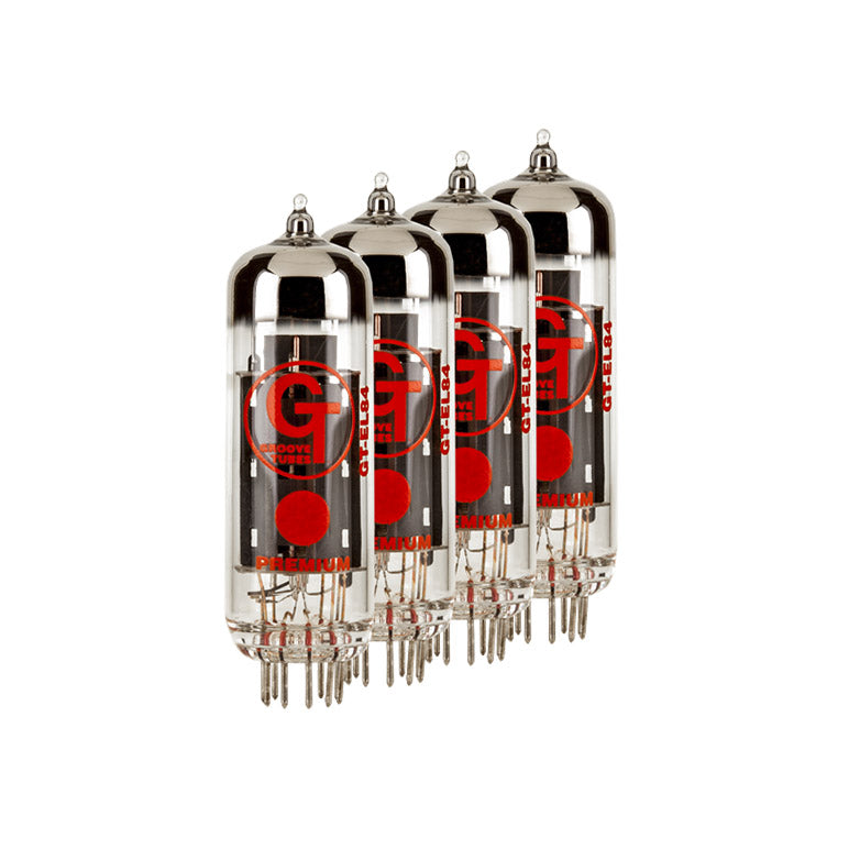 Four clear glass vacuum tubes with metal pins and red labeling reading GT EL84 and Groove Tubes.